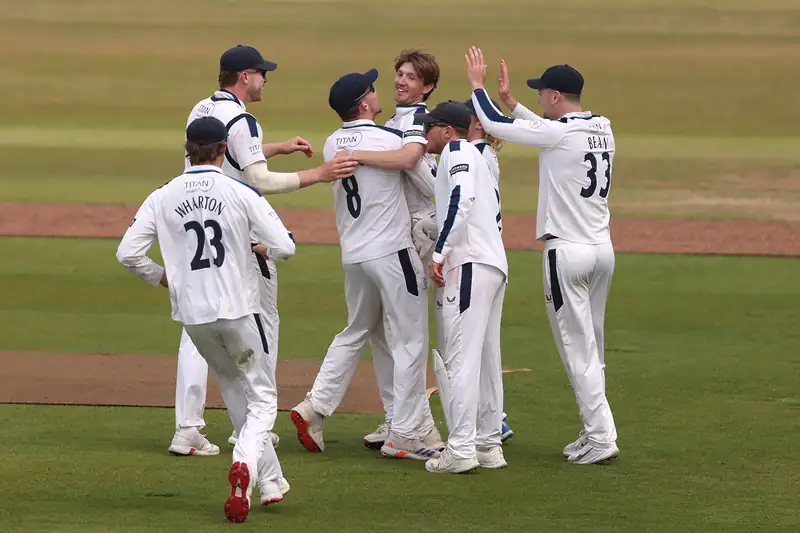 Cricket match in progress at Headingley with players on the field
