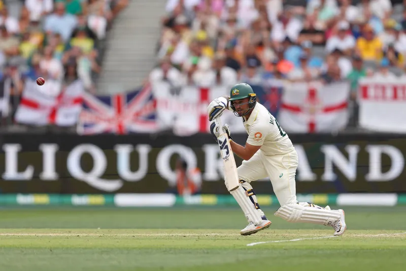 Australian cricket players in action on the field