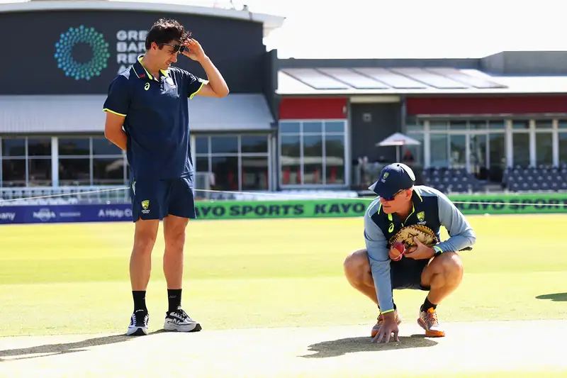 Australian cricket captain discussing strategy with team