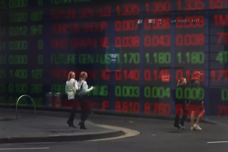 Australian stock market board displaying various stock prices