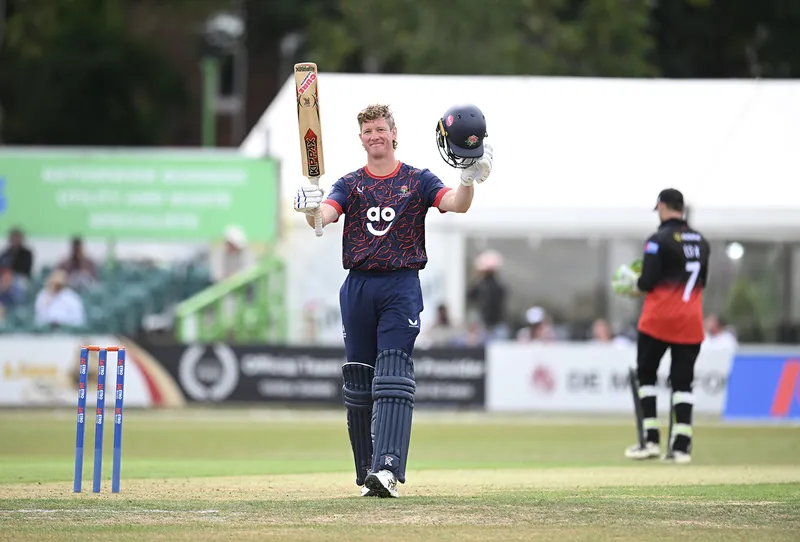 George Balderson celebrating his fifty during the match