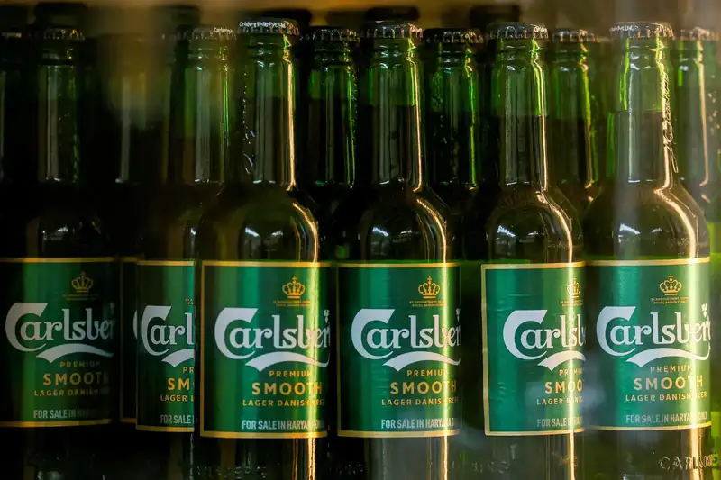 Carlsberg beer bottles in a production line