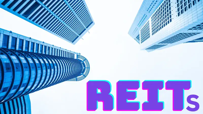 A modern commercial building representing real estate investment options