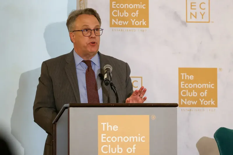 John Williams speaking at an economic conference