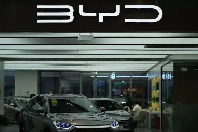 Rows of new vehicles lined up in a dealership lot