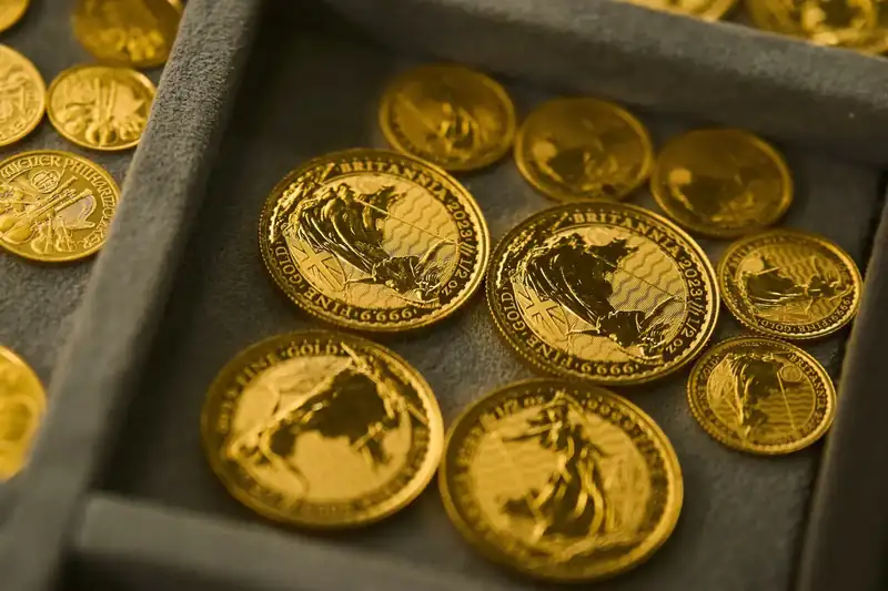 Gold bars stacked in a vault