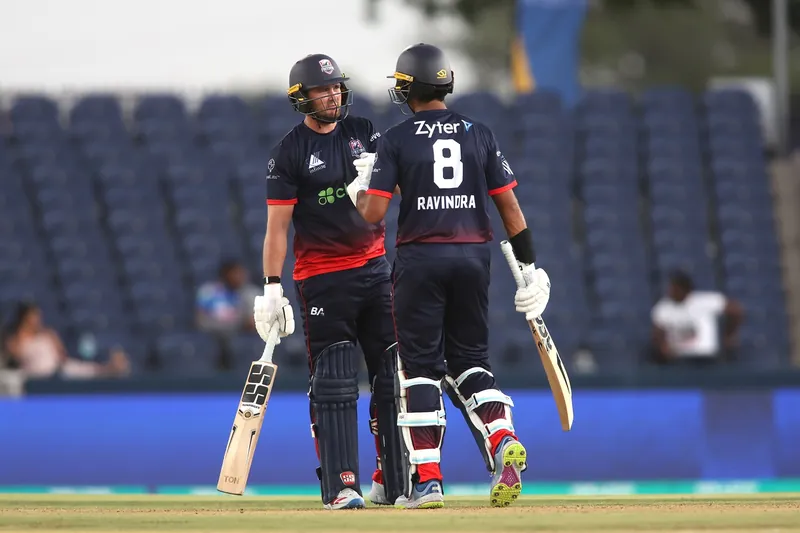 Cricket players in action during an IPL match