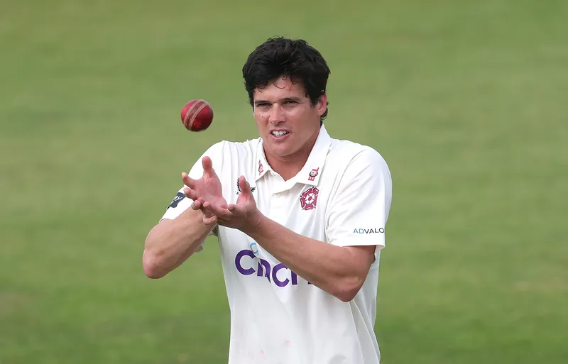 Cricket players in action during a match