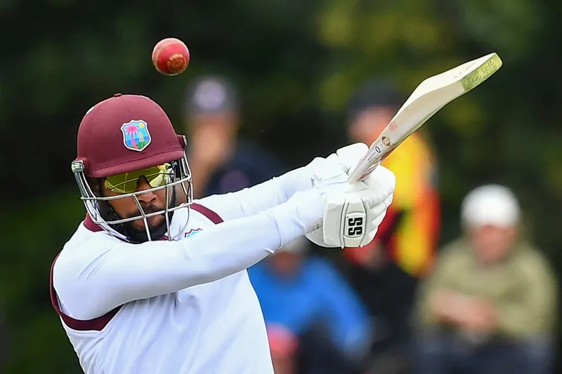 Sri Lankan and West Indies cricket teams in action on the field