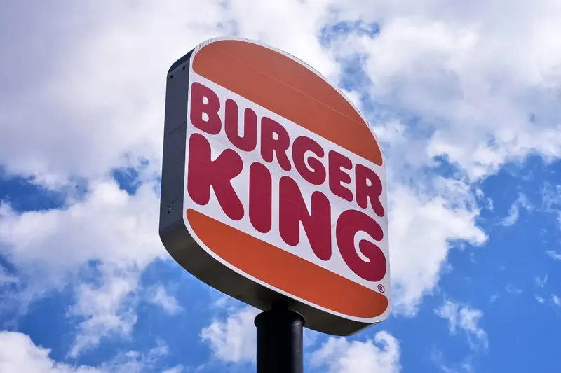 Inspira and Burger King logos with financial figures