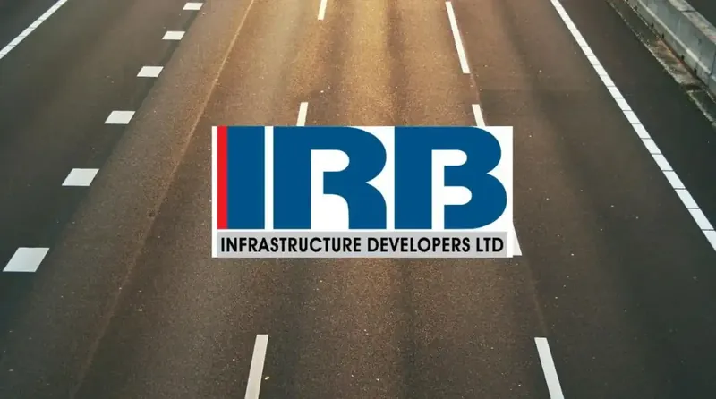 IRB Infrastructure Developers' office building with stock market graph overlay
