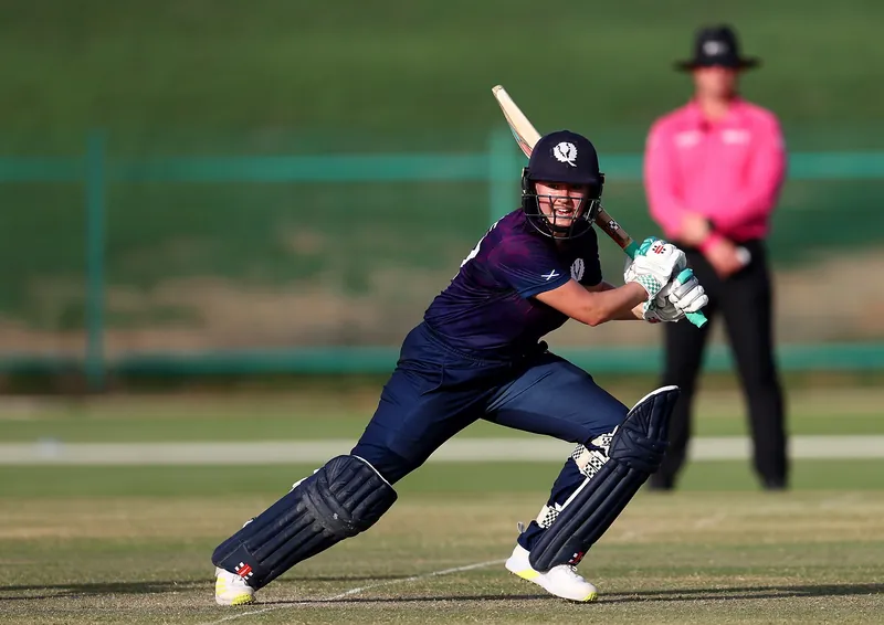 Cricket players in action during an international match