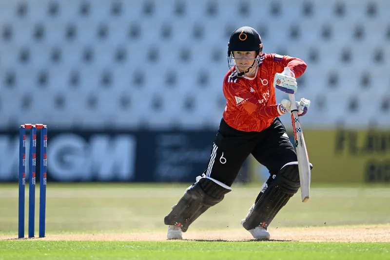 Cricket players in action during a match