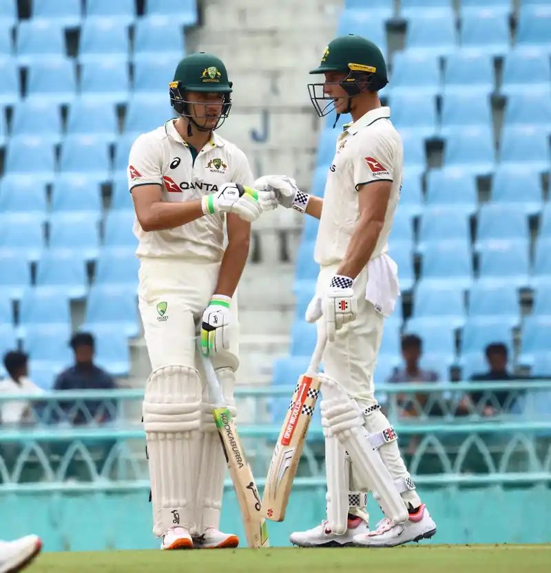 Cricket players on the field during a match
