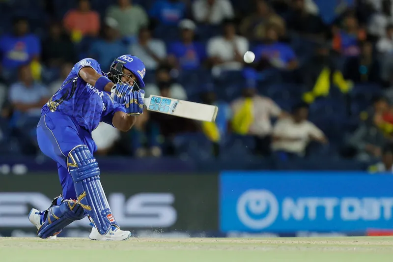 Romario Shepherd bowling during a cricket match