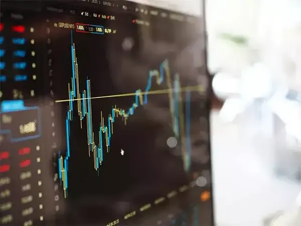 Stock market display board showing various stock prices
