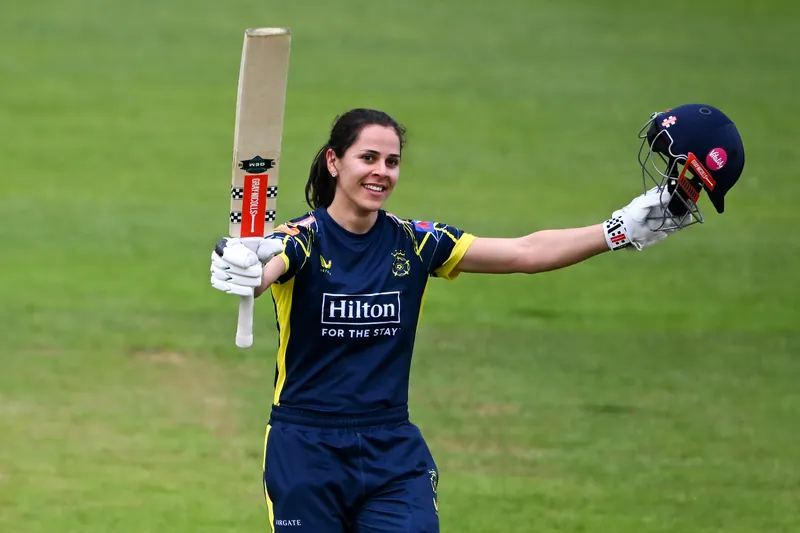 Maia Bouchier playing a shot during a cricket match