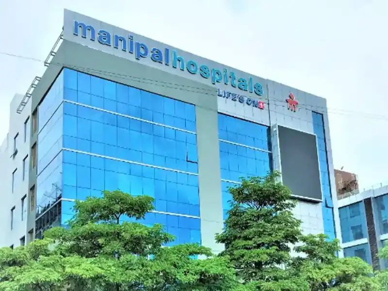 Manipal Health Enterprises logo and stock market chart