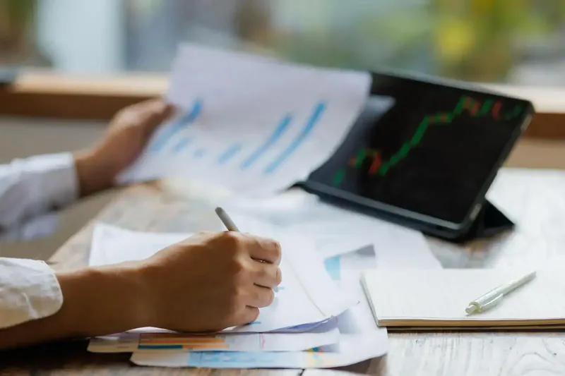 Investor analyzing financial data on a computer screen