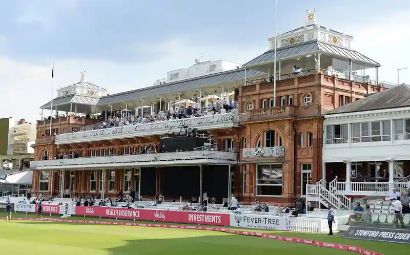 Empty seats at a cricket pavilion during a match