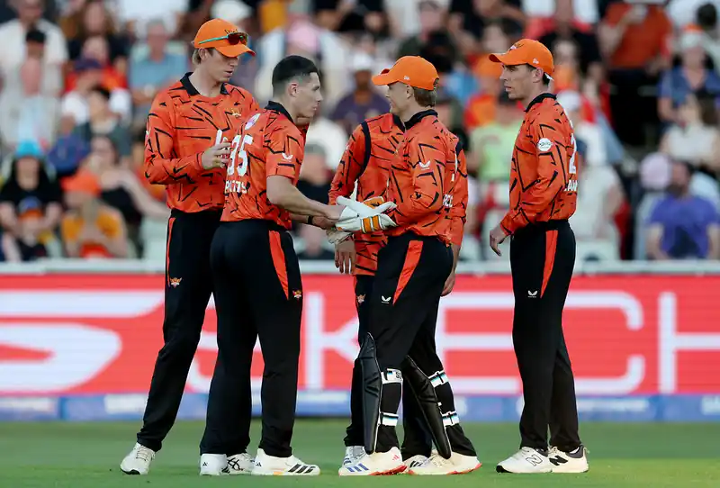 Cricket players in action during a Hundred match