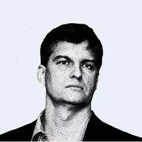 Michael Burry discussing investment strategies against a backdrop of stock market charts