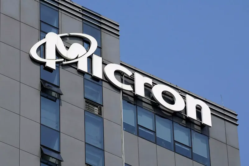 Micron Technology logo with declining stock graph