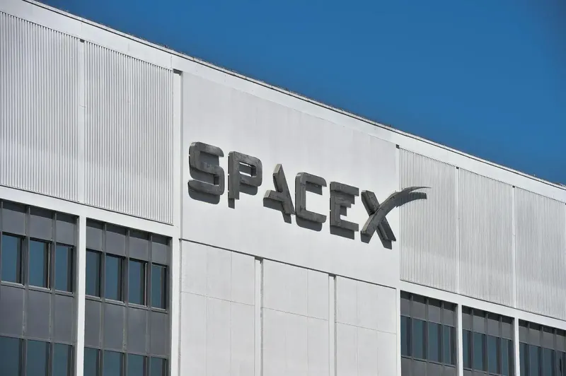 SpaceX rocket launch with clear sky background