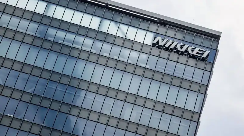 Tokyo stock exchange with digital stock ticker showing Nikkei index