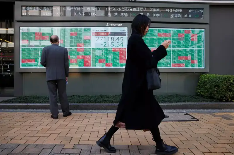 Tokyo Stock Exchange with fluctuating stock prices displayed