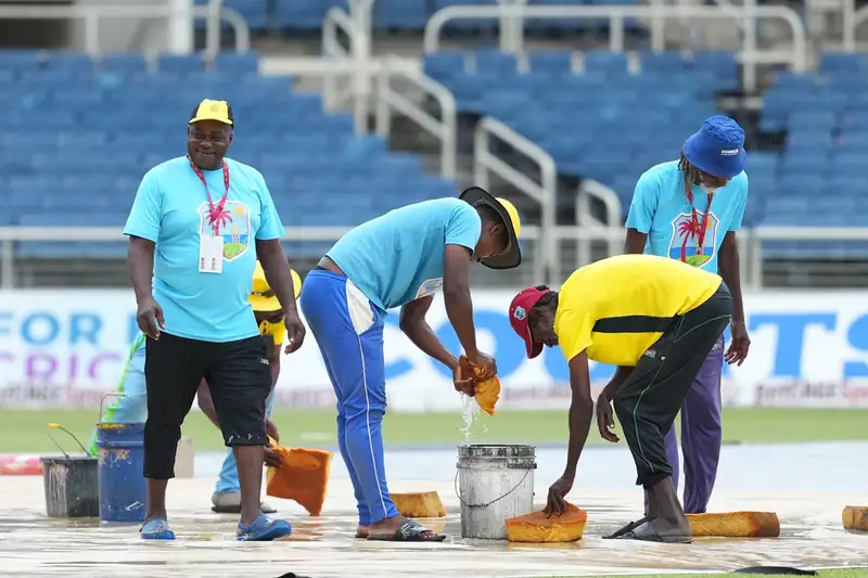Rain-soaked cricket field at Sabina Park, Kingston
