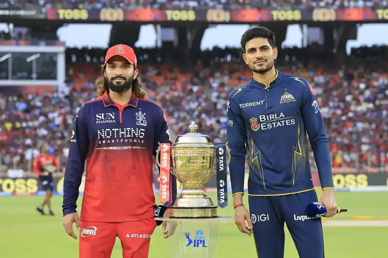 RCB and GT players on the field during an IPL match