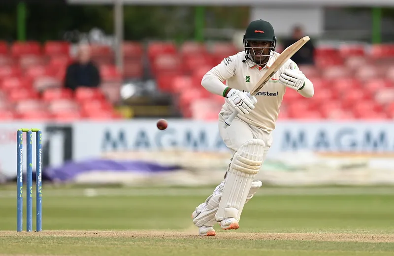 Rehan Ahmed and Ben Kelly celebrating their centuries on the cricket field