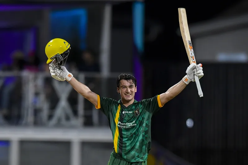 Maaz Sadaqat celebrating his century during the IPL match