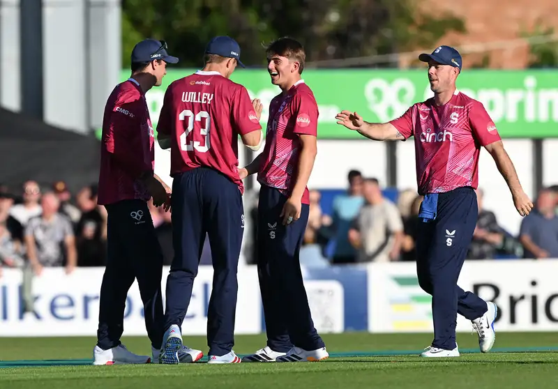 Cricket players in action during a match