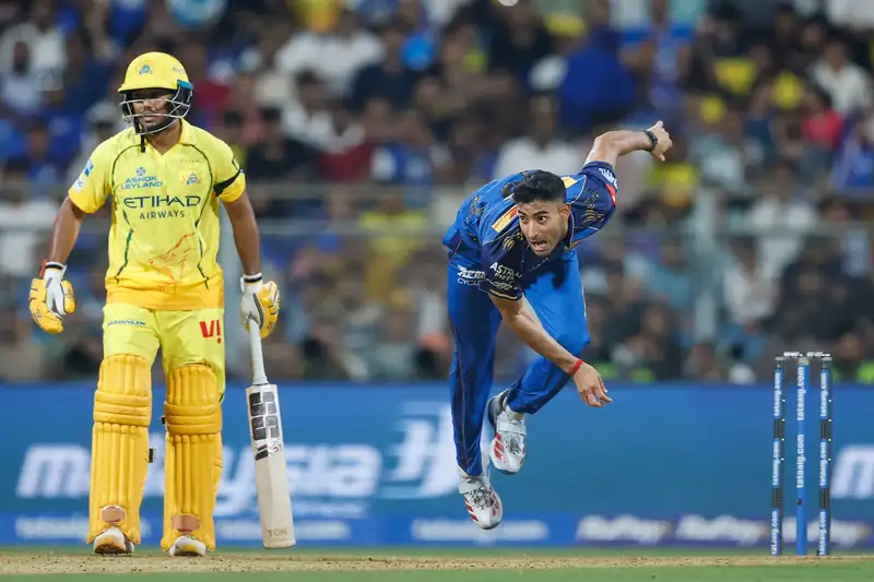 Krish Bhagat bowling in an IPL match for Mumbai Indians