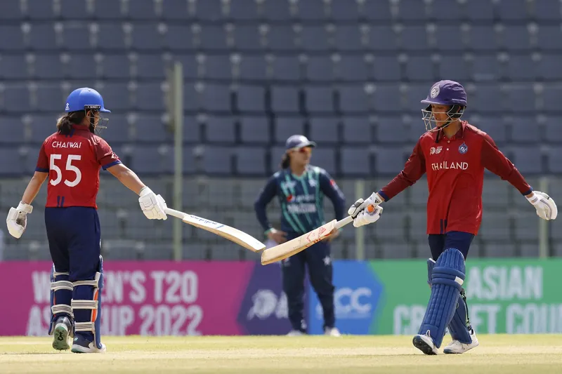 Thailand, Malaysia, and China women's cricket teams celebrate qualification.