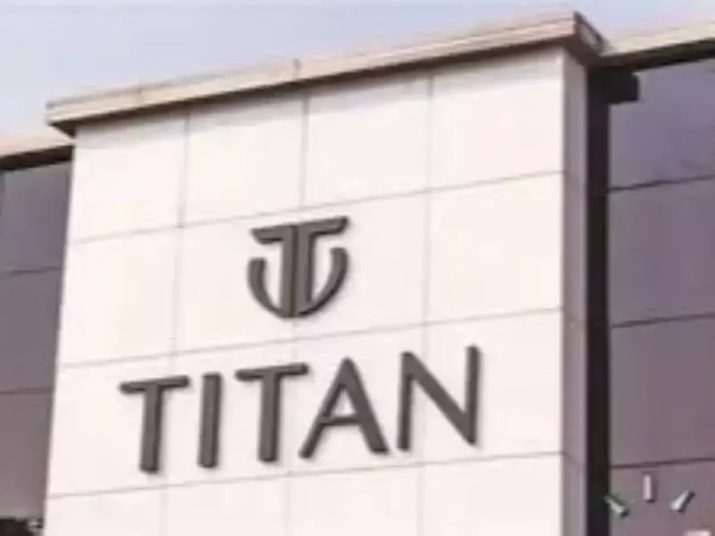 Titan Company logo and stock market graph