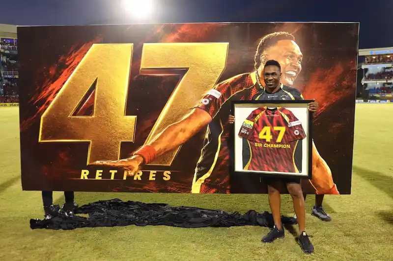 Dwayne Bravo holding a trophy with Trinbago Knight Riders