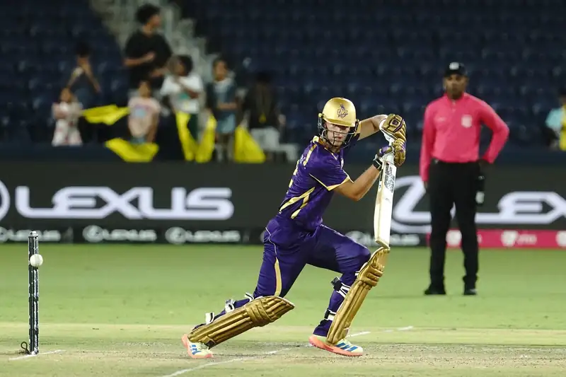 Cricket players celebrating a victory on the field