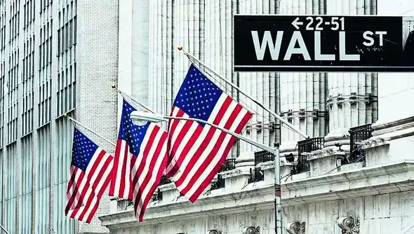 Stock market display board showing declining numbers